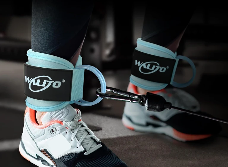 Blue cuff fastened above a shoe and connected to a cable